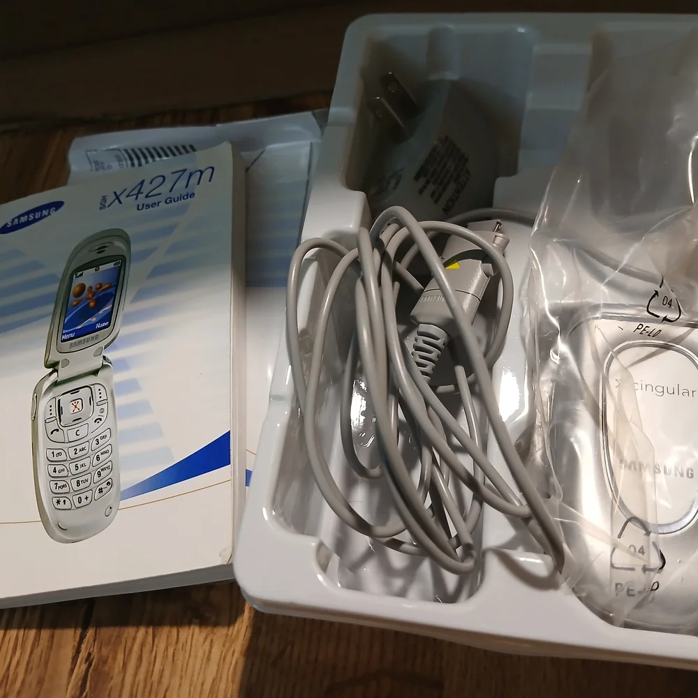 Samsung Silver Flip Phone with Accessories